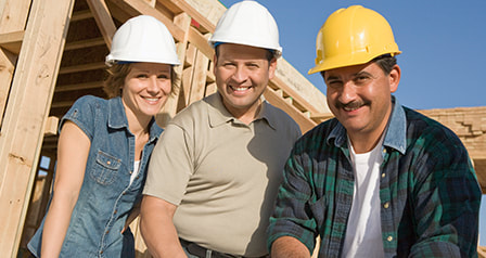 Three contractors building a house